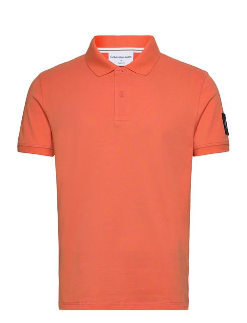 Se Calvin Klein Jeans Badge Polo Calvin Klein Jeans Orange ved Booztlet