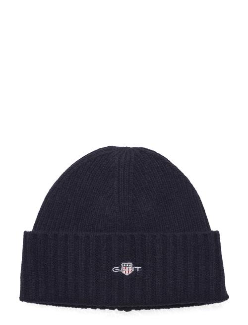 Se GANT Shield Beanie GANT Navy ved Booztlet