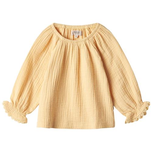 Se Wheat Merle Bluse Pale Apricot | Gul | 68 cm ved Babyshop