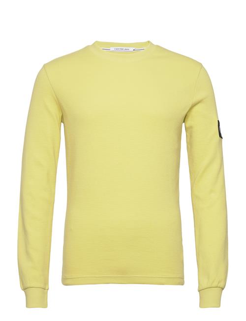 Se Calvin Klein Jeans Badge Waffle Ls Tee Calvin Klein Jeans Yellow ved Booztlet