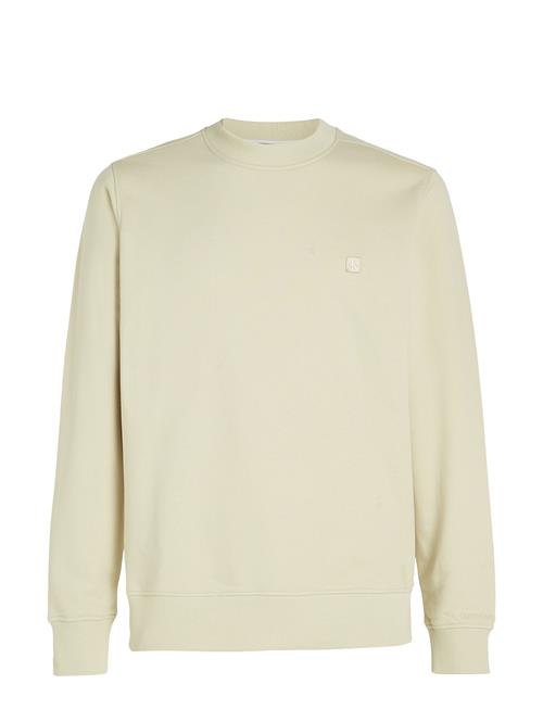 Se Calvin Klein Jeans Ck Embro Badge Crew Neck Calvin Klein Jeans Beige ved Booztlet