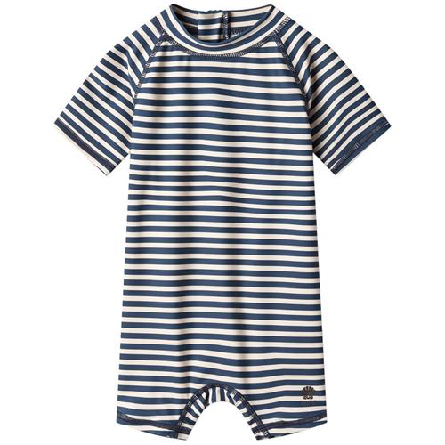 Se Wheat Cas Stribet UV-dragt Indigo | Marine blå | 80 cm ved Babyshop