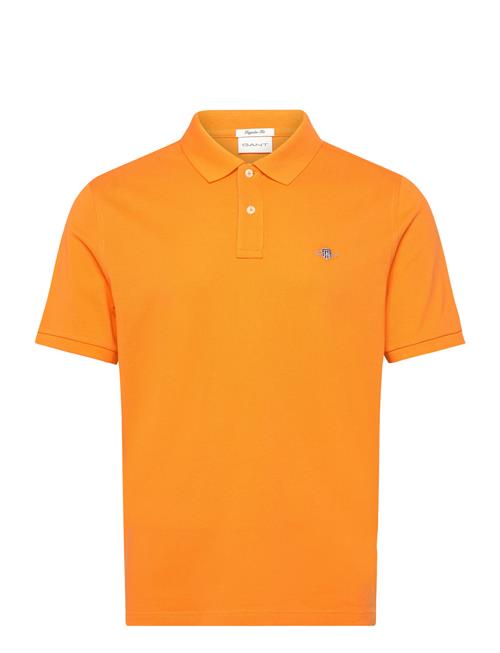 Se GANT Reg Shield Ss Pique Polo GANT Orange ved Booztlet