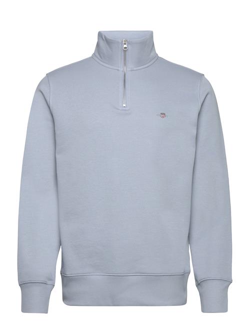 Se GANT Reg Shield Half Zip Sweat GANT Blue ved Booztlet