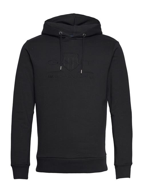 Se GANT Reg Tonal Shield Hoodie GANT Black ved Booztlet