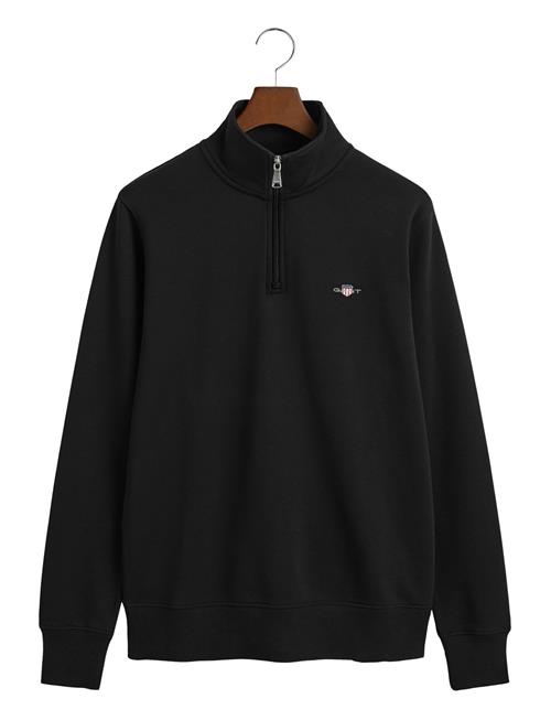 Se GANT Emb Archive Shield Half Zip GANT Black ved Booztlet