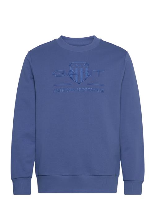 Se GANT Reg Tonal Shield Cneck Sweat GANT Blue ved Booztlet