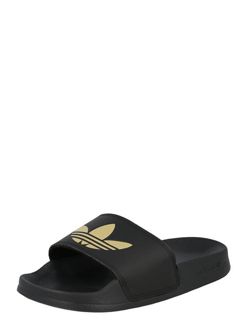 Se ADIDAS ORIGINALS Pantoletter 'Adilette Lite'  guld / sort ved About You