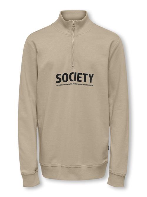 Se KIDS ONLY Sweatshirt  beige / sort ved About You