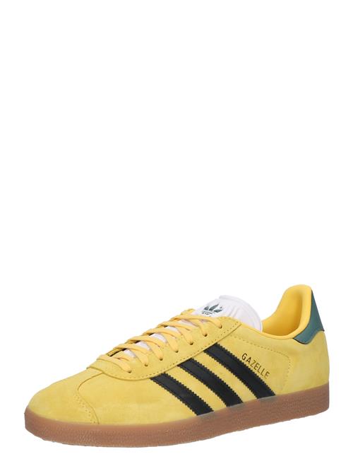 Se ADIDAS ORIGINALS Sneaker low 'GAZELLE REKIVE'  gul / sort / hvid ved About You