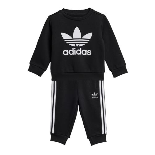 Se ADIDAS ORIGINALS Joggingdragt  sort / hvid ved About You