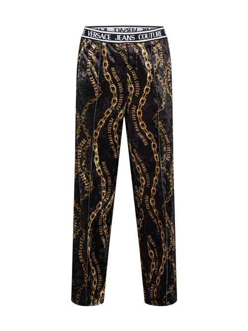 Se Versace Jeans Couture Bukser  guld / sort ved About You