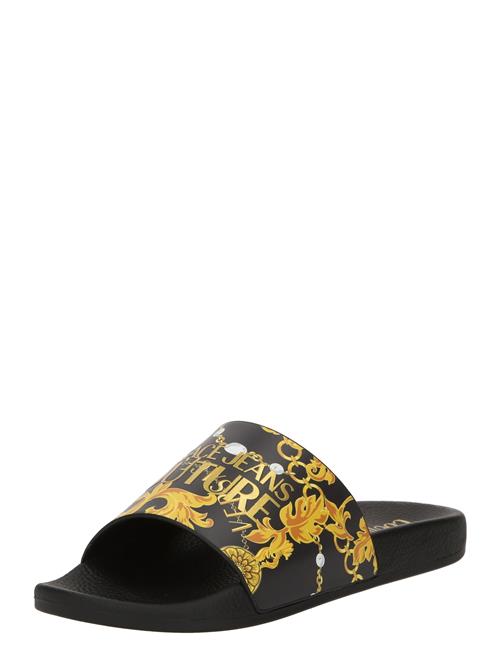 Versace Jeans Couture Pantoletter 'FONDO SHELLY'  gylden gul / safran / guld / sort