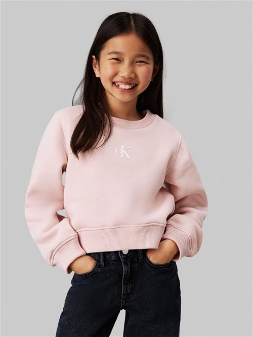 Se Calvin Klein CK Logo CN Fleece Sweatshirt Str 8 - Peach Whip Sweatshirts hos Magasin ved Magasin