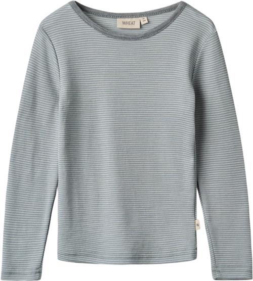 Se Wheat Langærmet Uld Tshirt Str 2 år / 92 cm Uld - Navy Stripe Langærmede T-shirts hos Magasin ved Magasin