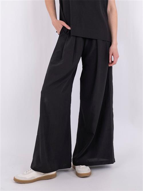 Se Neo Noir Lana Pants Kvinde Black Bukser Med Brede Ben Str 40 - hos Magasin ved Magasin