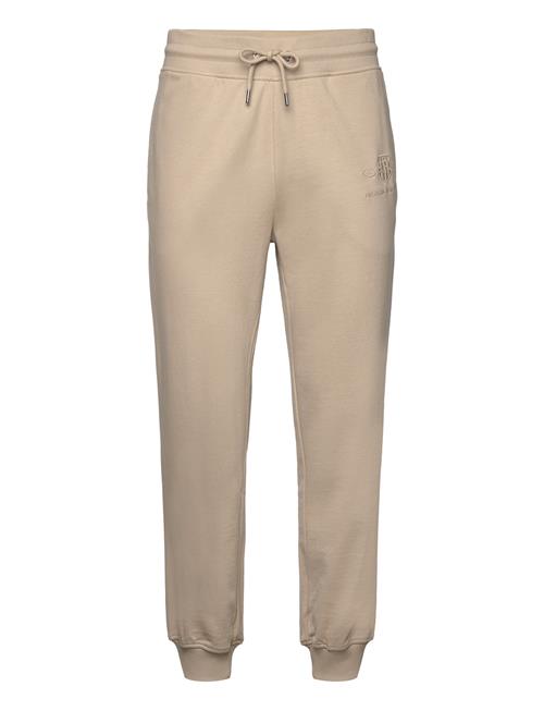 Se GANT Reg Tonal Shield Sweatpants GANT Beige ved Booztlet