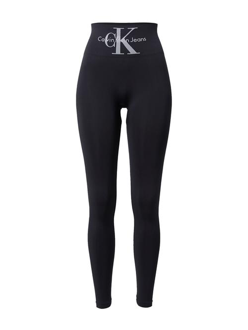 Se Calvin Klein Leggings  grå / sort ved About You