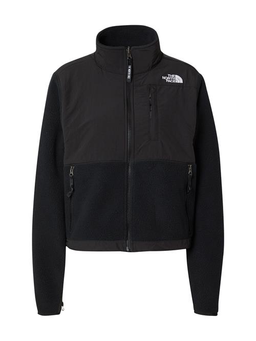 Se THE NORTH FACE Fleecejakke 'RETRO DENALI'  sort / hvid ved About You