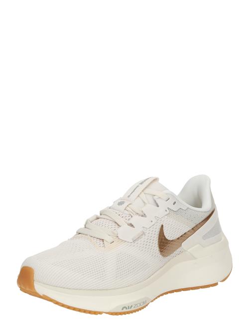 Se NIKE Løbesko 'Structure 25'  guld / hvid ved About You