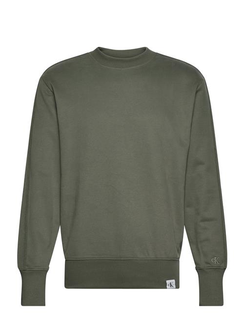 Se Calvin Klein Jeans Woven Tab Crew Neck Calvin Klein Jeans Green ved Booztlet