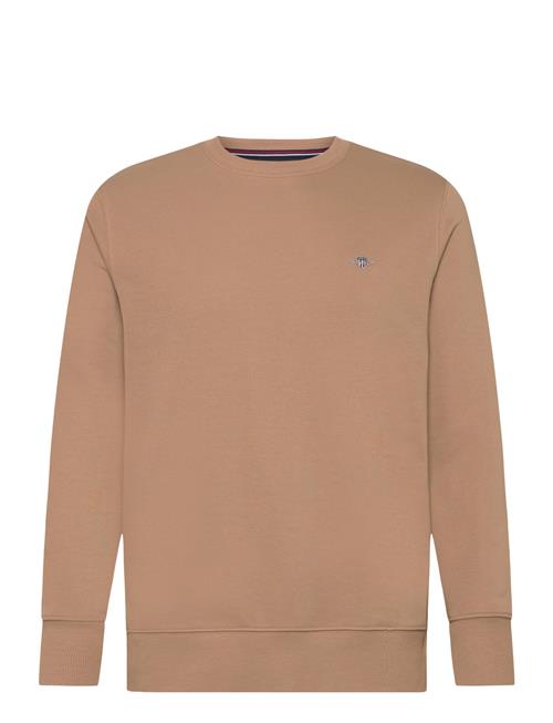 Se GANT Reg Shield C-Neck Sweat GANT Beige ved Booztlet