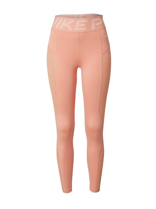 NIKE Sportsbukser  pastelorange / hvid