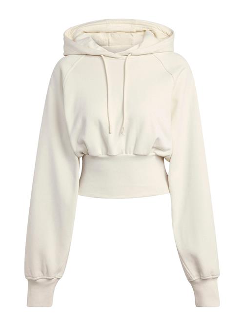 Se ADIDAS BY STELLA MCCARTNEY Sportsweatshirt 'adidas by Stella McCartney Cropped'  elfenben ved About You