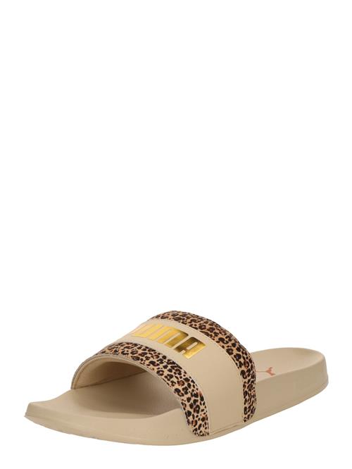 Se PUMA Pantoletter 'Leadcat 2.0'  brun / mørkebrun / guld / hvid ved About You