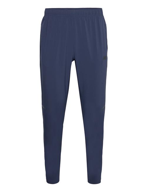 Se Tenacity Stretch Woven Pant New Balance Blue ved Booztlet