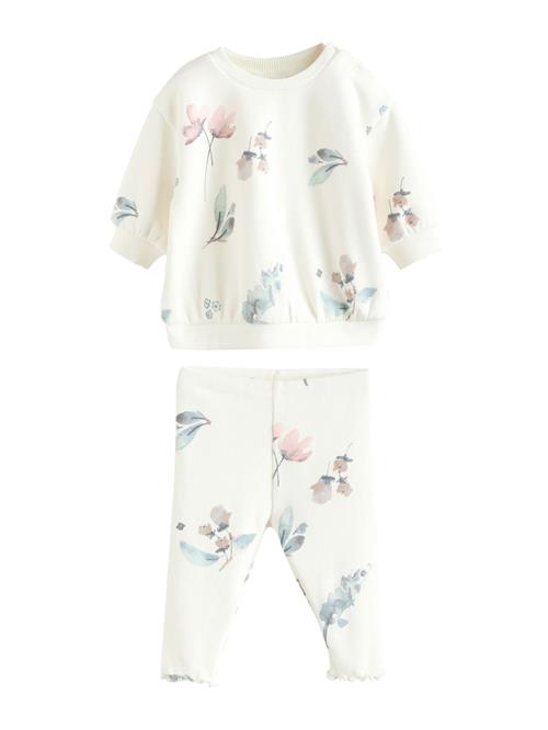 Next Joggingdragt  lyseblå / lyserød / sort / uldhvid