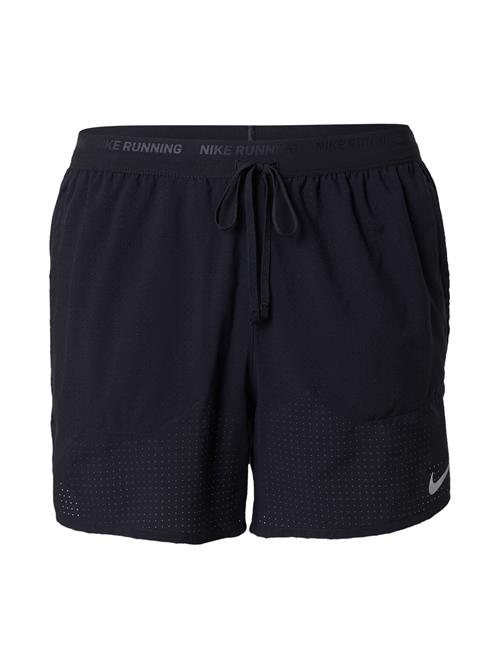 NIKE Sportsbukser 'STRIDE'  sort