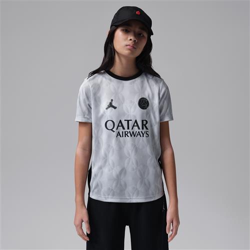 Kortærmet Paris Saint-Germain Academy Pro Night Edition Jordan Dri-FIT-opvarmningstrøje til fodbold til større børn - grå