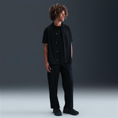 Nike 24.7 PerfectStretch Dri-FIT-chinobukser med løs pasform til mænd - sort